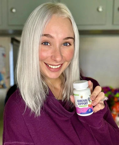 A customer showing her Sunny Sam supplement bottle