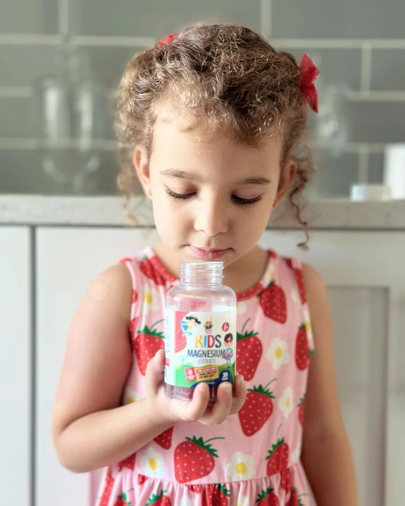 Child with a Sunny Sam Kids Magnesium bottle.